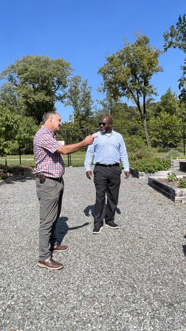 Pitman, left, talks about work in the teaching garden.