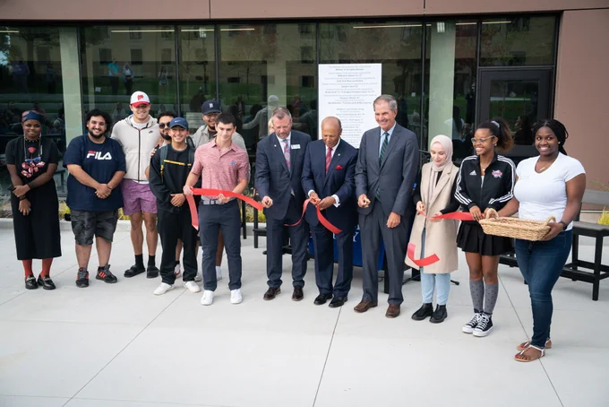 Current University President Donald Taylor, former President Antoine M. Garibaldi and students cutting the ribbon at the Student Union Center