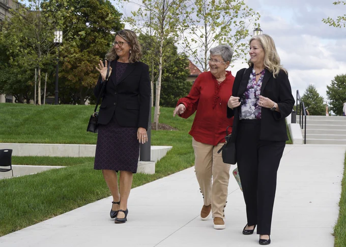 Dean Jocelyn Boryczka (left) walking with one College of Liberal Arts & Education's donors, Jamie Dylenski, M.A., '98 (center)
