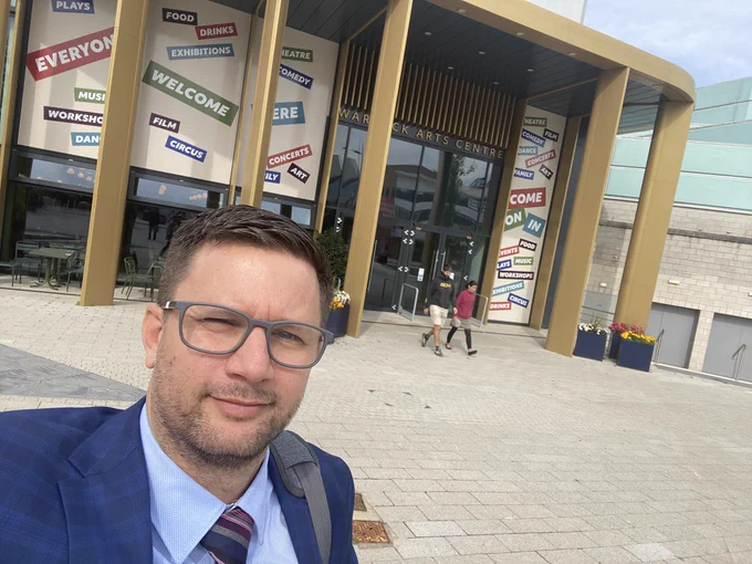 Selfie of me at main entrance to Warwick Arts Centre