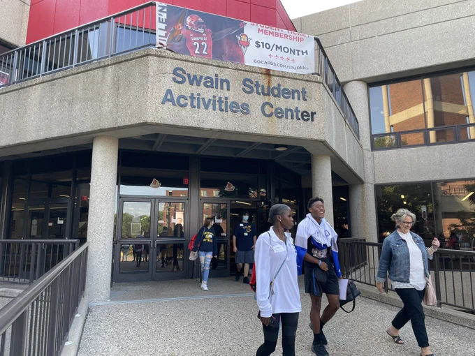 Four JCPS students and an adult leave the Swain Student Activities Center at the University of Louisville.