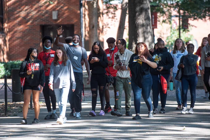 JCPS students walk outside on the University of Louisville campus.