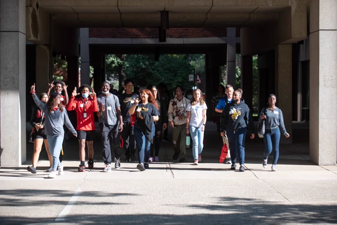 JCPS students walk outside on the University of Louisville's campus.