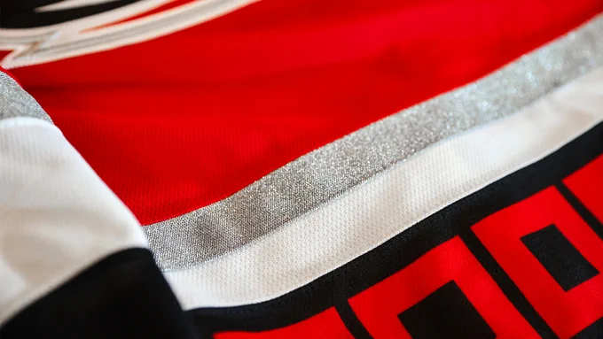 Photo of the piping of the Canes 25th Anniversary sweater
