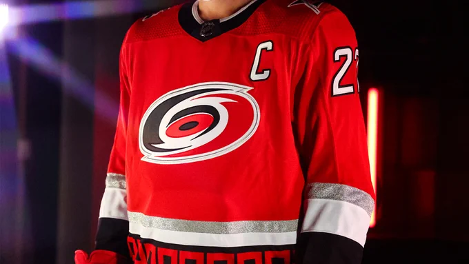 Photo of the front of the Canes 25th Anniversary sweater