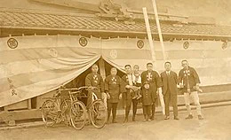 Photo Discription: Kongō Yoshie, the 38th master carpenter of Kongō Gumi and employees.

Source: Wikipedia.com