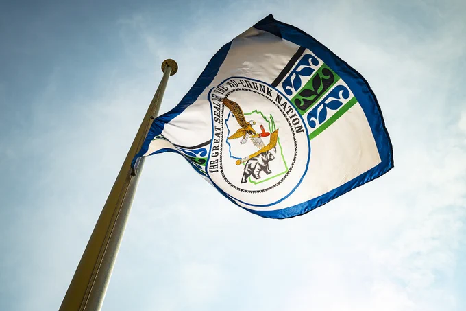The flag of the Ho-Chunk Nation flies on a flagpole in front of Bascom Hall.