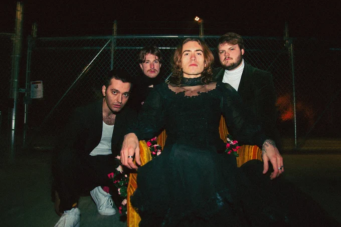 portrait of the four members of Present Company