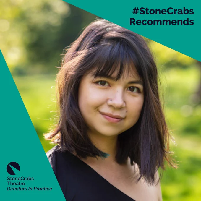 A teal background with a photo in a spotlight shining from the upper left corner. Dark indigo text in the upper right corner reads: #StoneCrabs Recommends. The photo in the spotlight is of a young woman with light brown skin and a dark brown bob with a fringe. She is wearing a black, one-shouldered top and the background shows a blurred out garden.