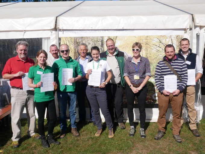 Some members of the Forestry and Climate Change Partnership celebrate the publication earlier in 2022 of the Forestry and Climate Change Accord