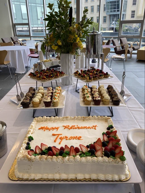 A retirement cake and other desserts in celebration of Dean Cannon's retirement from the University of San Francisco.