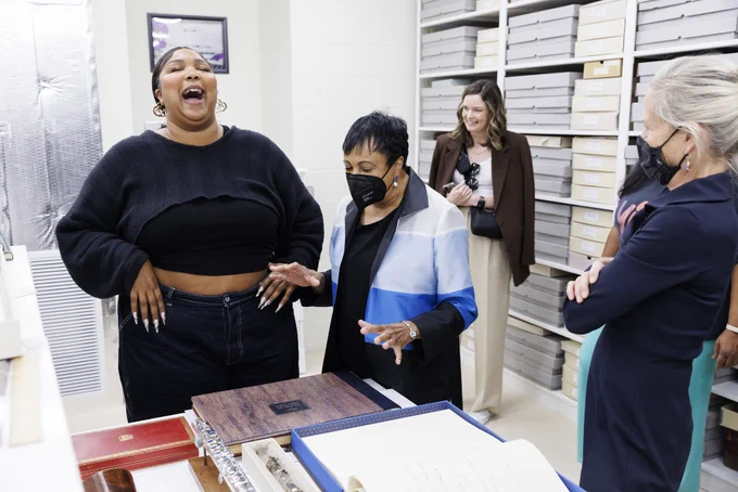 Lizzo and Librarian of Congress Carla Hayden with flute vault curator Carol Lynn Ward-Bamford, September 26, 2022.

Photo by Shawn Miller/Library of Congress.