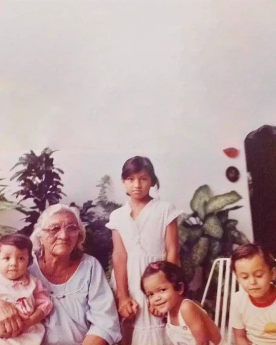 Paula as a young girl with her siblings and grandmother, who is of an Indigenous background.