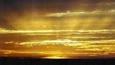Sunset with rays of light as the sun disappears at Half Moon Bay, California
