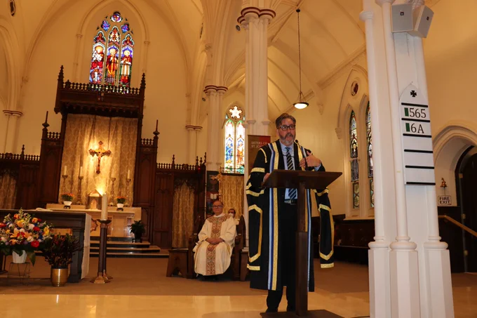 University of St. Michael's College President David Sylvester welcomes people to the 2022 Michaelmas Mass. 