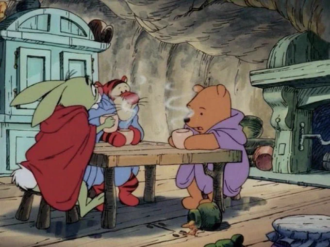 Pooh, Tigger, and Rabbit somberly drinking tea.