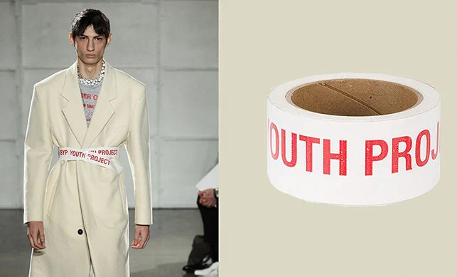 A model wearing a belt made of duct take that says "Youth Project"