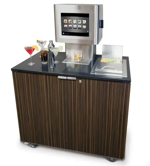 A brown bar cart with what looks like an old desktop computer attached on top. On the cart there are various cocktails.