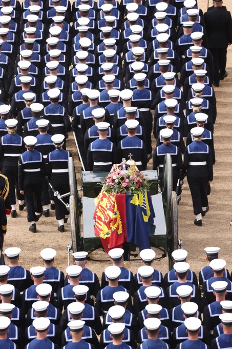 HM Armed Forces lead the procession for Her Majesty The Queen's coffin from Westminster Abbey.
