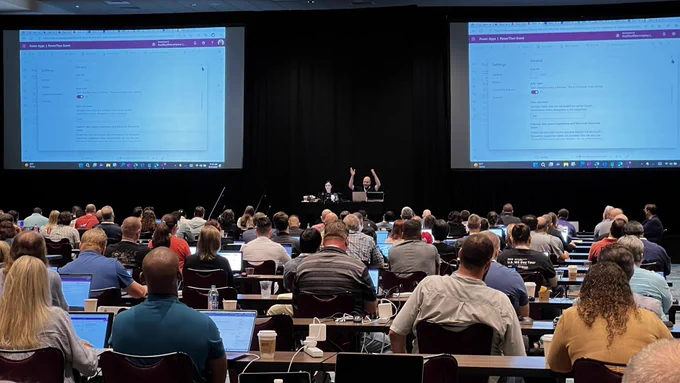 April Dunnam & Hugo delivering a workshop in front of an audience