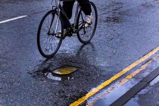 Bike passing a pothole