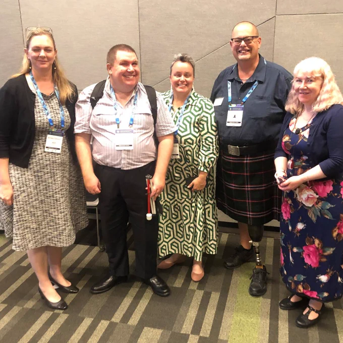 PWDA Board members Clare Gibellini and Andrew Fairbairn, with Sam French, and Ben Clare and Michaela Sargent from Exemplar International smiling in a conference room. 