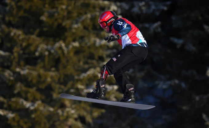 mike schultz catches air during the 2021 para snow sports world championships boardercross competition