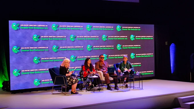 Panelists at the stage of spotlight event