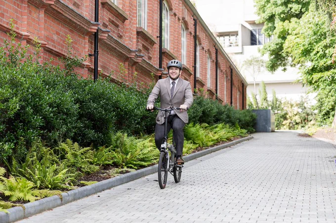 Man commuting on a foldable bike
