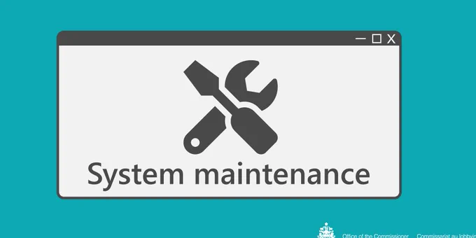 A wrench and a screwdriver are displayed above the words system maintenance. 