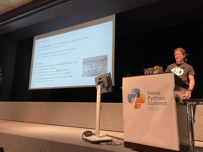 Florian at the lectern, with a slide describing his problem.