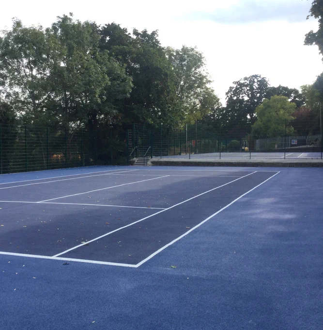photo of newly painted tennis courts (with lines)