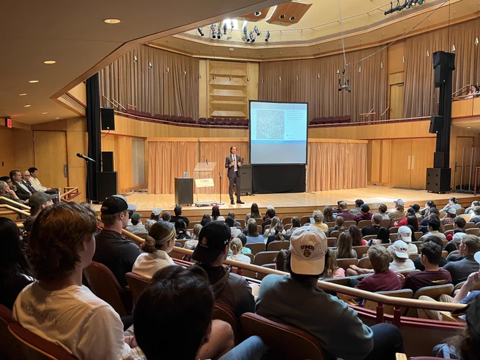 Dr. Ted Miguel speaks to a full Weber Music Hall on Wedneday, Sept. 21st.