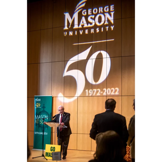 SciTech Director of Administration and Operations Ron Carmichael speaking at a podium.