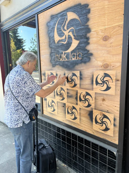 Ron Lancaster noticing math in the Huk Lab disc golf shop sign.