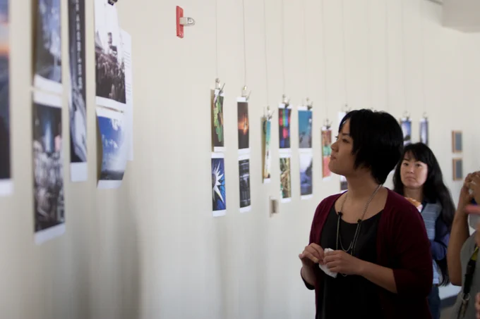 Student looking at art in BSC. 