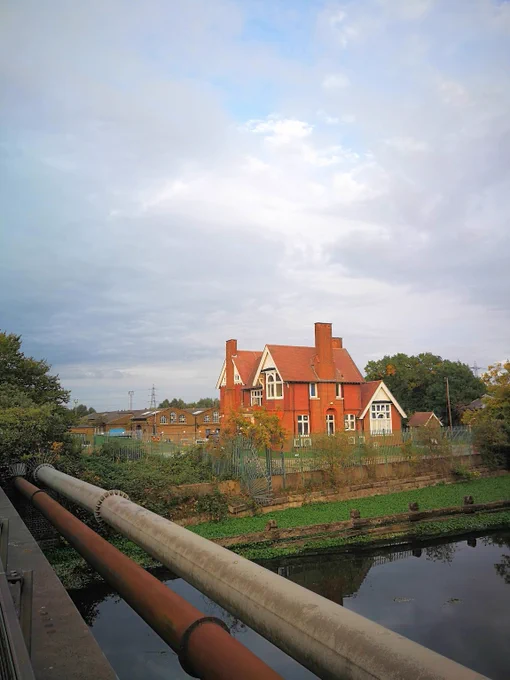 Photo of the River Lea with the Engineer's House and the Prince and Princess Boiler Sheds in the background. 