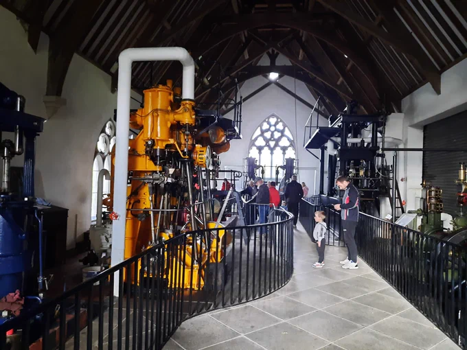 Inside the Steam Museum showing large steam engines behind railings