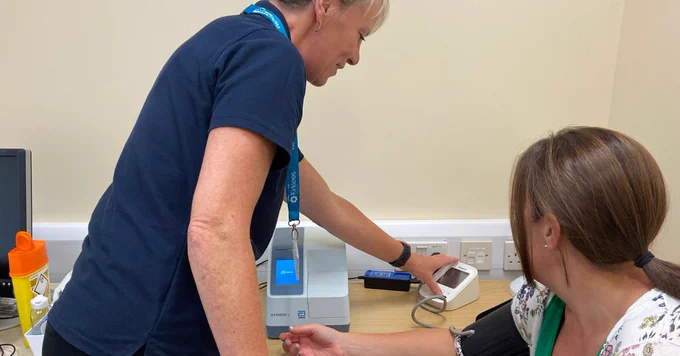 Resident receiving a health check