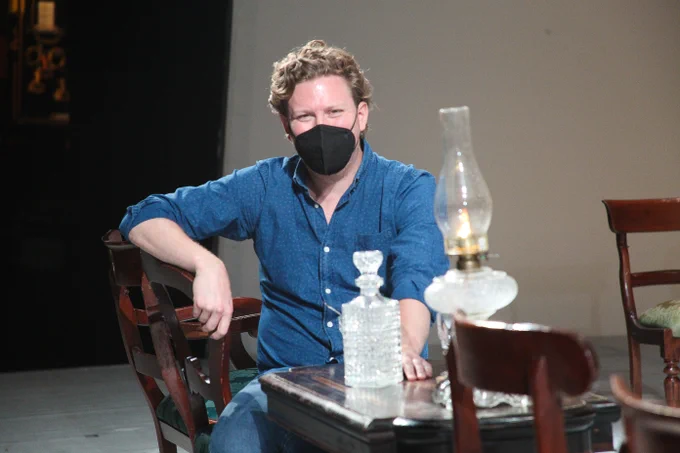 Gordon Bintner, sitting on stage at rehearsals. Photo by Griner
