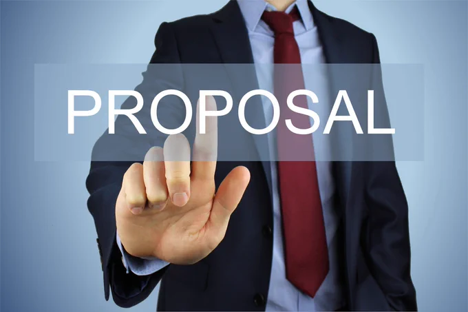 A picture showing the word proposal with a man in the background wearing a suit, red tie and blue shirt, and his finger is pointing to the fourth letter of the word proposal with is P

License: Creative Commons 3 - CC BY-SA 3.0

Original Author: Nick Youngson - link to - http://www.nyphotographic.com/

Original Image: https://pix4free.org/photo/15851/proposal.html

License permits: Sharing, copying and redistributing in any medium or format including adapting, remixing, transforming, and building upon the material for any purpose, even commercially, attribution is required to obtain and maintain a license.