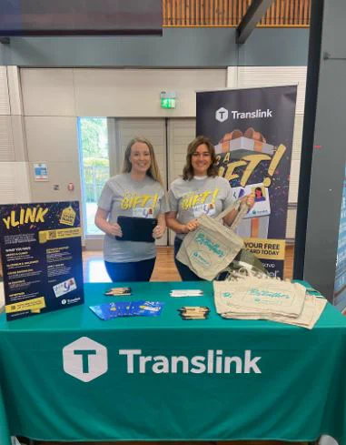 Team Translink behind a desk at Coleraine Freshers