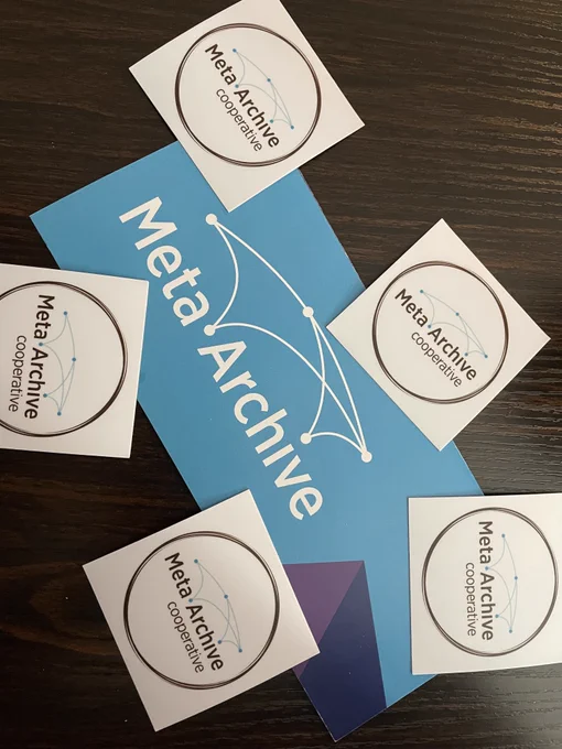 Photo of MetaArchive branded stickers and an informational trifold. 