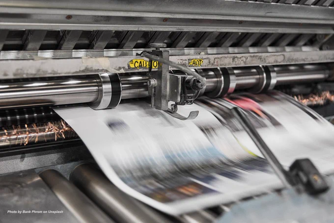 Photo of printing press by Bank Phrom on Unsplash