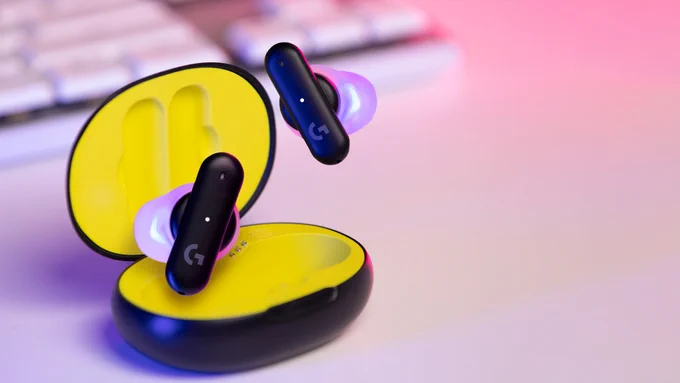 The Logitech G FITS earbuds. The earbuds are floating out of its case.
