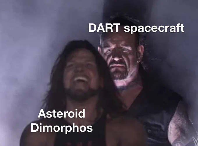A meme showing Undertaker standing behind AJ Styles. Undertaker has a frightening expression on his face and the text on him says “DART spacecraft”. AJ Styles is smiling and the text on him says “Asteroid Dimorphos”.