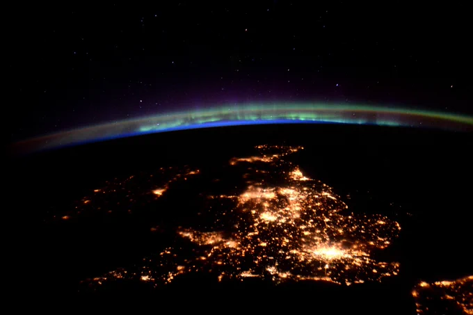 A satellite image of the UK under aurora. 