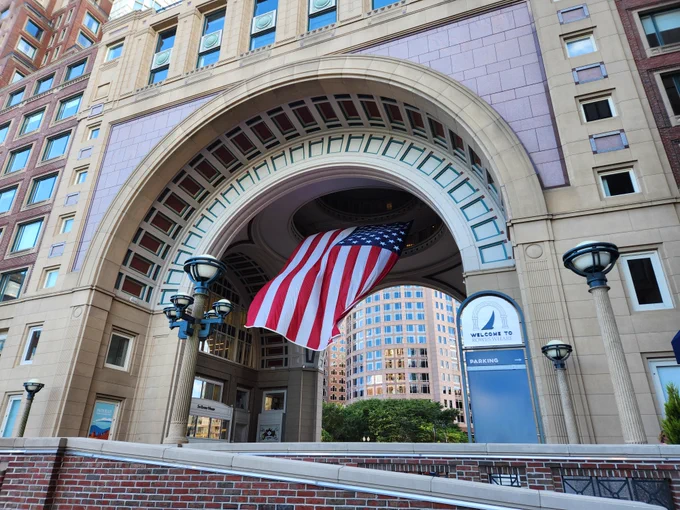 U.S. flag flying in the archway of Rowes Wharf in Boston, Massachusetts