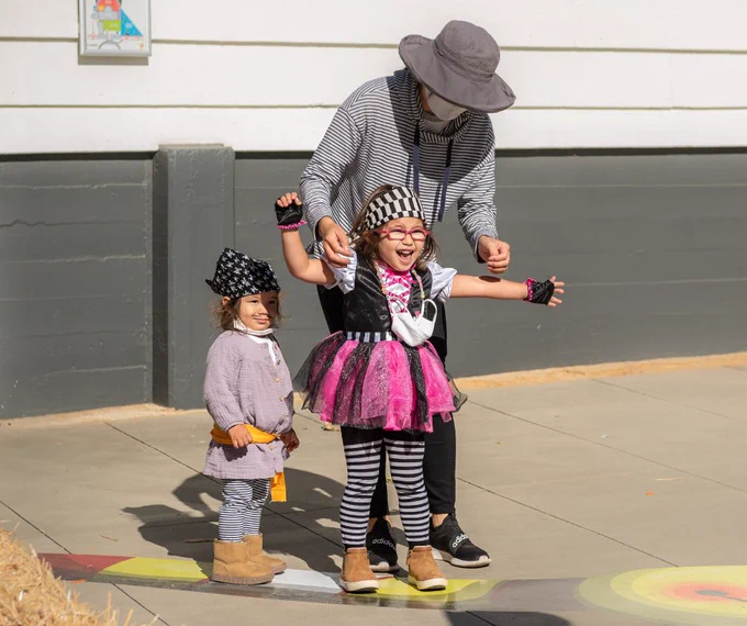 Children in costume with adult