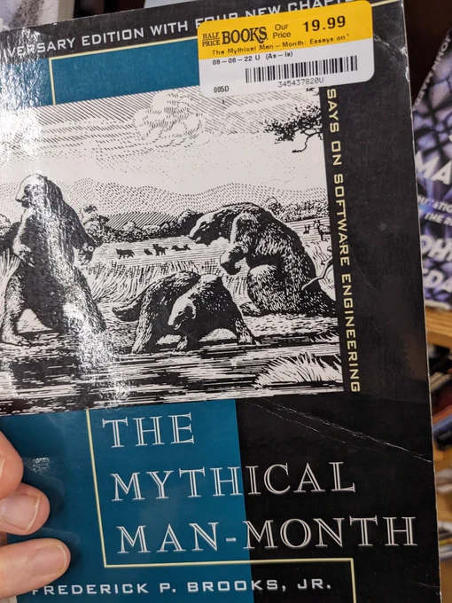 Cover of the book The Mythical Man-Month by Frederick P. Brooks, Jr. with $19.99 price sticker.